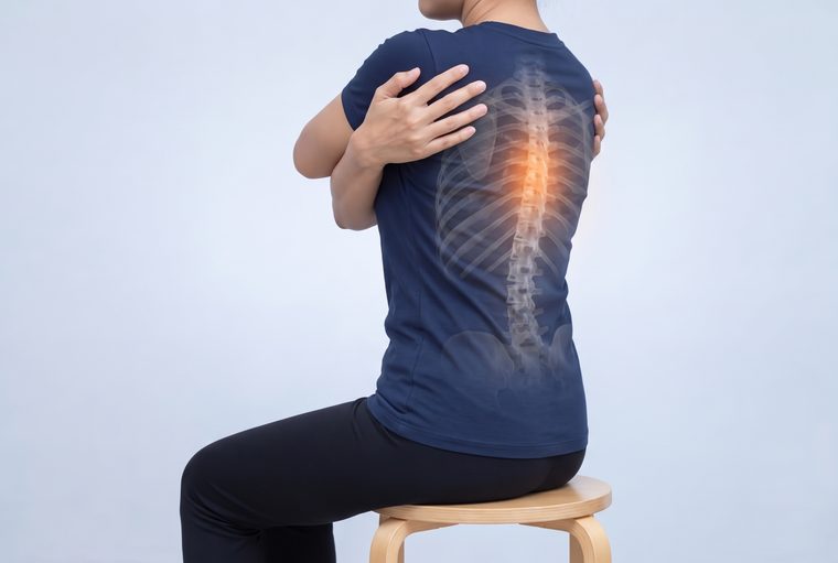 Sitting on a stool with the arms crossed over the chest, slowly turning the upper body to one side.